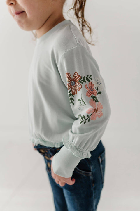 Girls Ruffle Hem Sweatshirt in Floral Sleeves Misty Blue