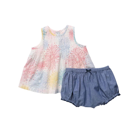 Children's sleeveless top with floral pattern and denim shorts on a light gray background