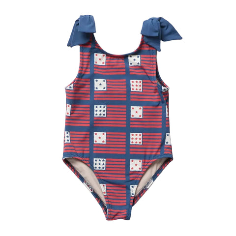Children's swimsuit with red and blue pattern on a white background